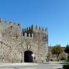 Trancoso castle, the Meadow Gate. View of a castle set gate between two strong square towers with crenellations.